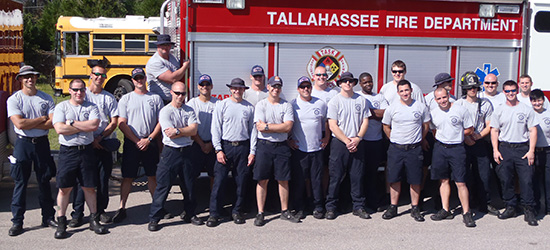 The Tallahassee Fire Department lined up in front of a truck